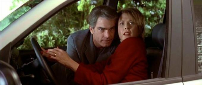 Carolyn and lover, inside a car, being flagrant