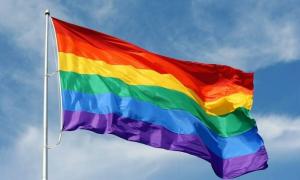 Gilbert Baker and his rainbow flag