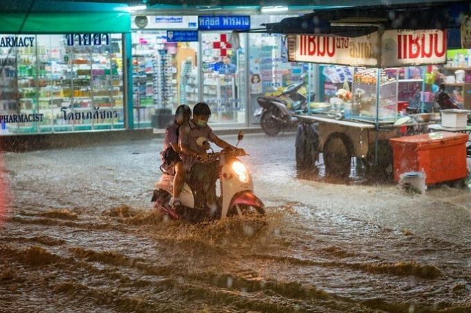 Natural phenomena flooded street in a city in Thailand because of a monson